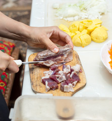 minced meat in the kitchen with a knife on a cutting board