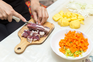 minced meat in the kitchen with a knife on a cutting board