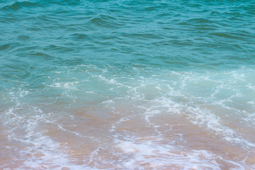 Sea surface with waves and foam, top view, natural background