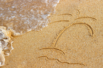 Palm tree painted on the sand and sea wave, summer background top view
