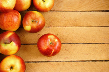 Red apples on wooden box bottom