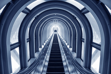 Futuristic escalator in modern tunnel
