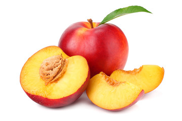 Nectarine with green leaf and slices isolated on white background