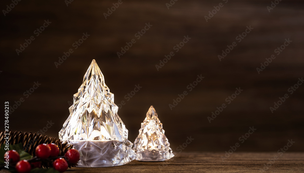 Poster modern glass christmas tree with lights on dark wood table with wall for merry chirstmas and new yea
