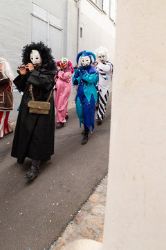 Archivgaesslein, Basel, Switzerland - March 12th, 2019. Close-up of a group of disguised piccolo flute players