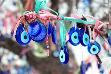 Evil eye charms hang from a tree in Cappadocia, Anatolia, Turkey