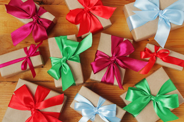 Gifts packed with craft paper and colorful satin ribbons	