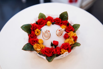 Gold wedding rings on stand for rings