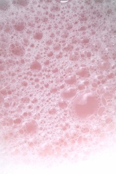 soap bubbles gently pink color. pink soap foam macro background.Bath foam. hygiene and cleanliness