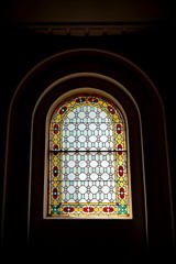 Bright and colorful stained glass window stock photo from inside