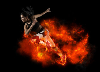 Woman running on fire background