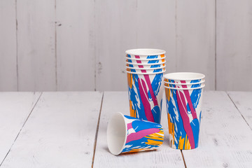 Disposable paper cups for coffee to go on wooden table