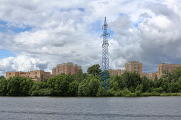 Fototapeta na wymiar Residential buildings on the banks of the picturesque Moscow river on a summer day, Russia