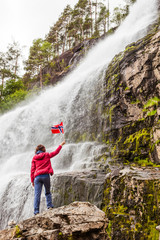 Obraz premium Tourist woman at waterfall Svandalsfossen, Norway