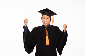 Asian Graduate man in cap and gown smile Celebrating with Confident emotional so proud and happiness in Graduation day,Isolated on white Background,Education Graduation Concept