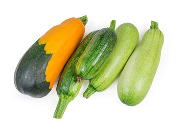 Top view of vegetable marrows and zucchini on white background