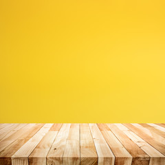 Naklejka na ściany i meble Empty of wood table top on yellow pastel color background