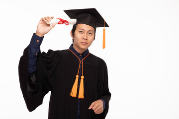 Asian Graduate man in cap and gown smile isolated on white