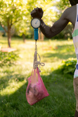 farmer hand weigh the collected harvest to sell