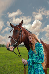 Fototapeta premium Pretty young girl together with her hors