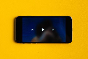close up play button interface on a modern gadget when watching video