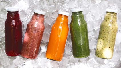Five day ration of different fresh detox drinks in glass