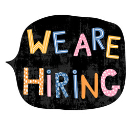 Hand written colorful letters with text - We are hiring in speech bubble in chackboard black color for creative jobs