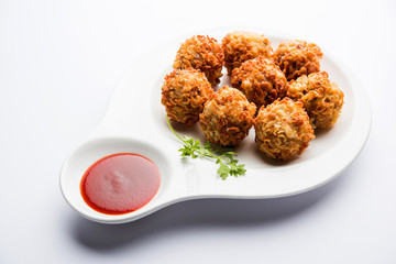 Crispy Noodles/maggie Pakora or pakoda is a popular indochinese street food served with ketchup