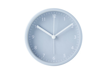 Gray classic alarm clock on a pastel blue background with copy space