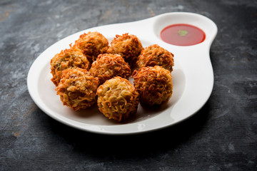 Crispy Noodles/maggie Pakora or pakoda is a popular indochinese street food served with ketchup