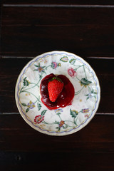 Strawberry jam with fresh berries on the plate