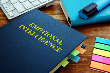 Emotional Intelligence guide and notepads in office.