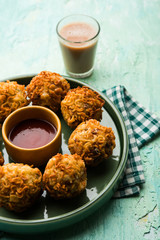 Crispy Noodles/maggie Pakora or pakoda is a popular indochinese street food served with ketchup