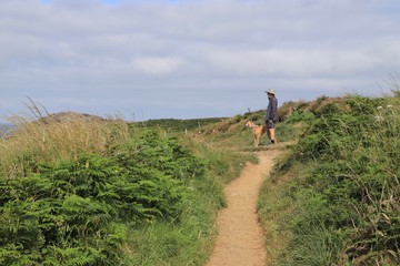 Man and Dog On Coastal Path