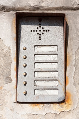 Old damaged worn vintage rusty apartment entry phone / Intercom panel with buttons high quality texture asset. Game texture grunge post apocalytpic assets