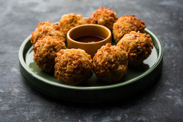 Crispy Noodles/maggie Pakora or pakoda is a popular indochinese street food served with ketchup