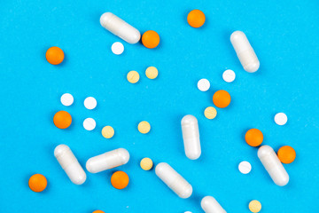 Tablets medicaments on a blue background