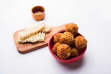 Crispy Noodles/maggie Pakora or pakoda is a popular indochinese street food served with ketchup