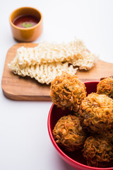Crispy Noodles/maggie Pakora or pakoda is a popular indochinese street food served with ketchup