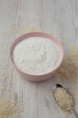 Gluten free rice flour in a pink bowl, low angle view. Close-up.