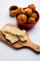 Crispy Noodles/maggie Pakora or pakoda is a popular indochinese street food served with ketchup