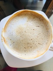 cup of coffee on wooden background