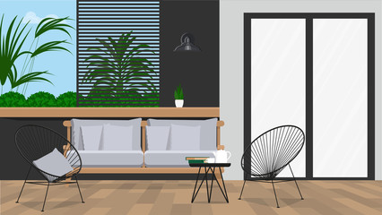 Garden furniture on the background of the wall with plants.