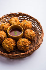 Crispy Noodles/maggie Pakora or pakoda is a popular indochinese street food served with ketchup