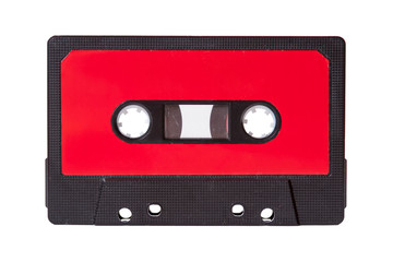 Naklejka premium Blank red vintage cassette tape with an empty label isolated on white background, old retro audio equipment concept. More copy space