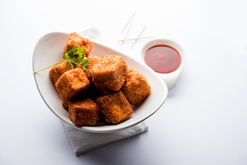 Crispy Paneer popcorn is a popular party snack and an appetiser. selective focus