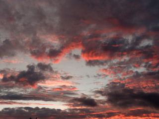 bloody menacing clouds at sunset in the evening