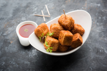 Crispy Paneer popcorn is a popular party snack and an appetiser. selective focus