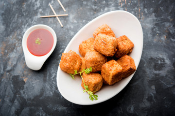 Crispy Paneer popcorn is a popular party snack and an appetiser. selective focus