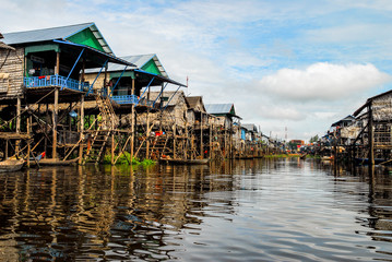 Simple houses in bamboo and wood under stilts in the floating village of Siem Reap, Cambodia